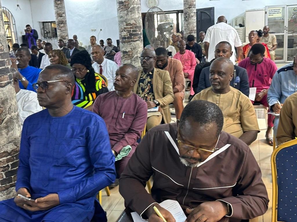 Congregation members engaged in a church conference and teaching session